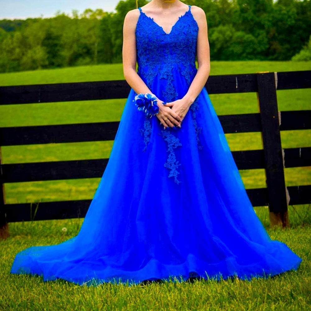 My prom dress it’s a size 00, Royal blue with gem flowers on top!
